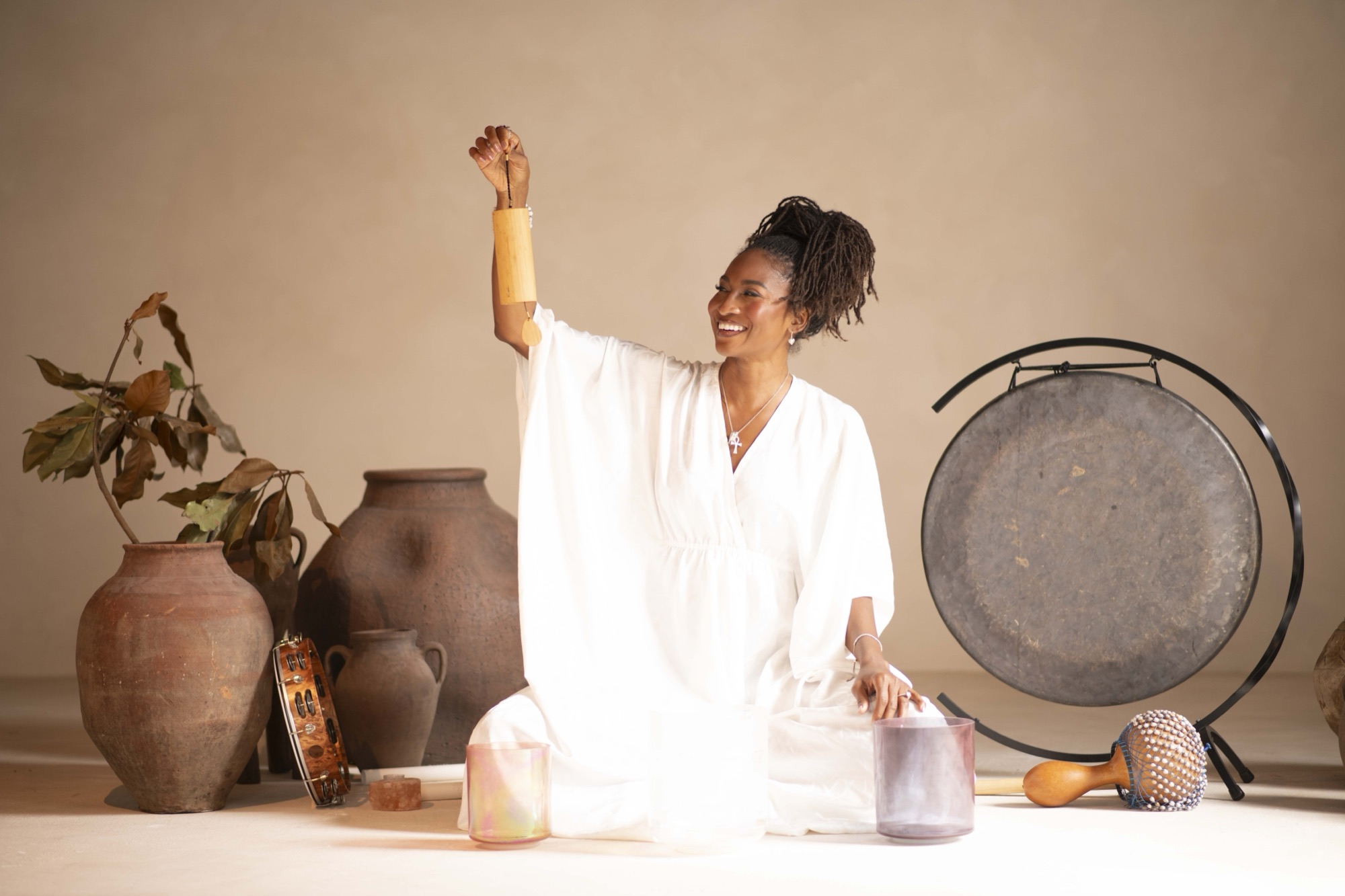 Koya Webb with a gong and singing bowls