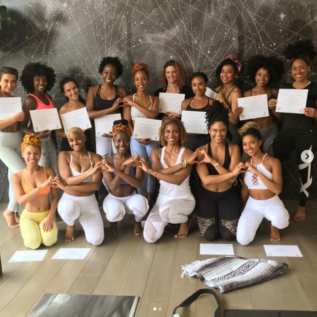 A training group holding their certificates